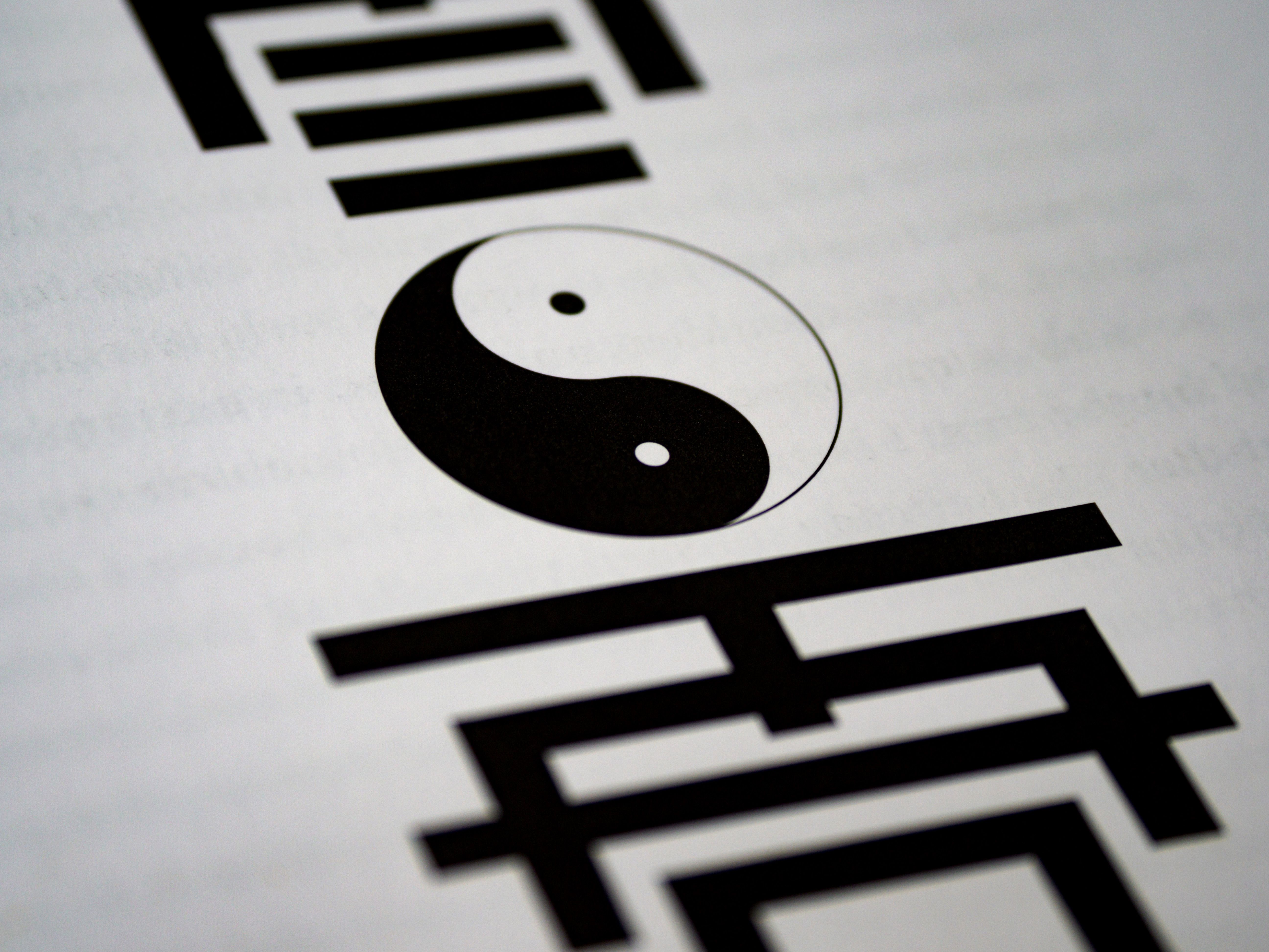 A yin-yang symbol surrounded by Chinese characters — the visual language of classical Chinese metaphysics